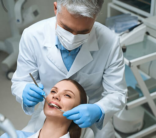 Dentist Examining Woman