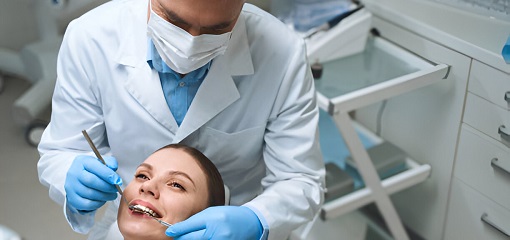 Dentist Is Examining Woman